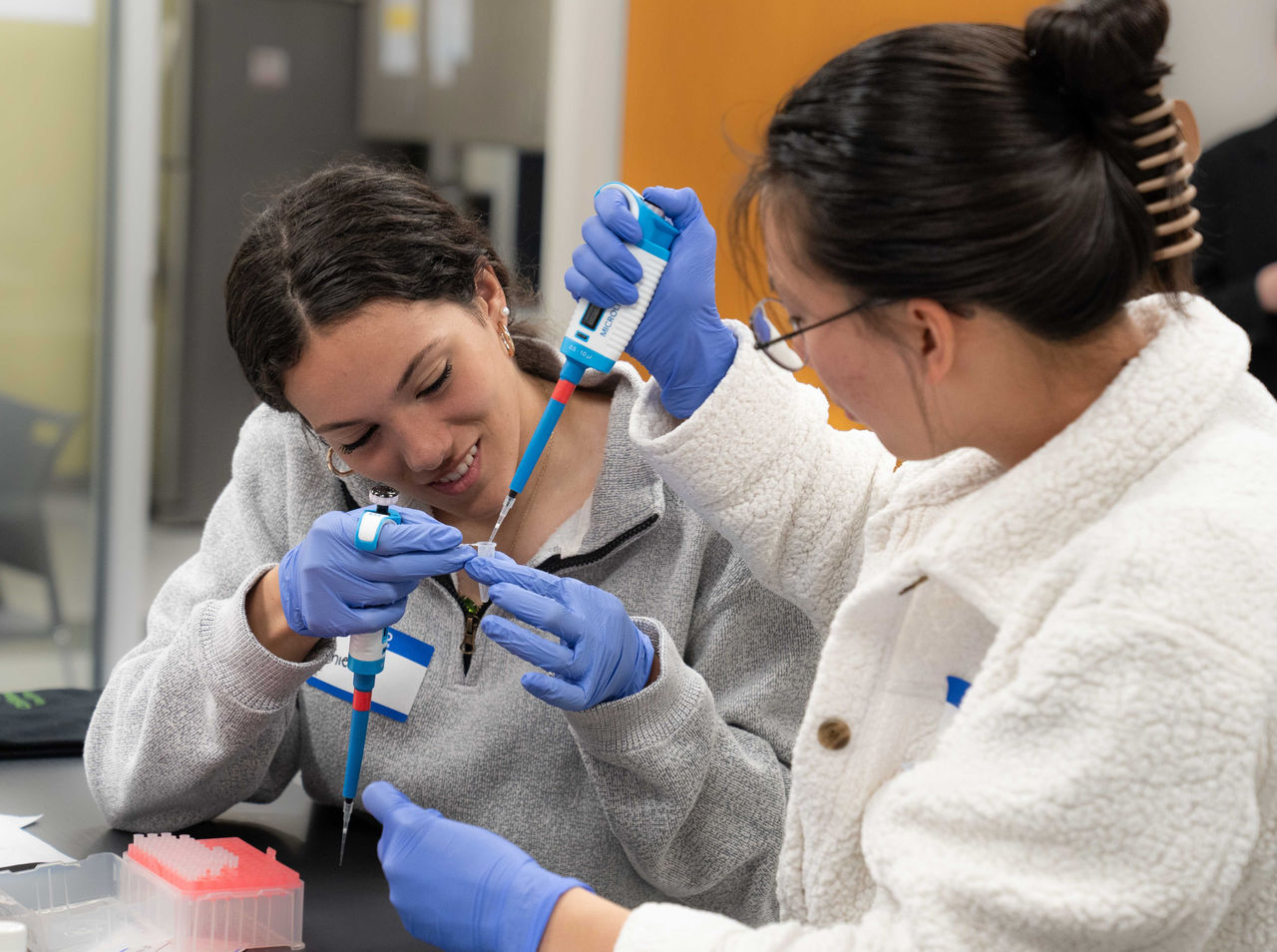 CSW Students Pipetting and Smiling